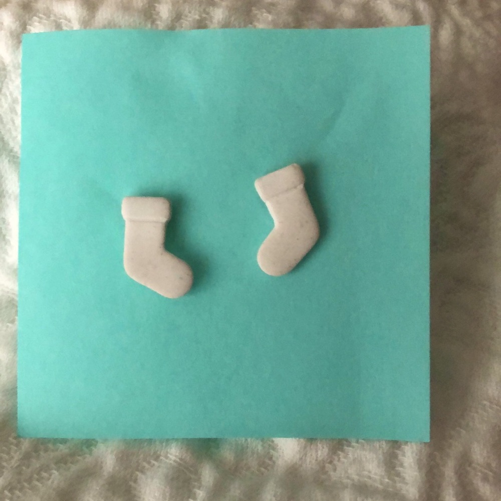 White resin , stocking earrings .